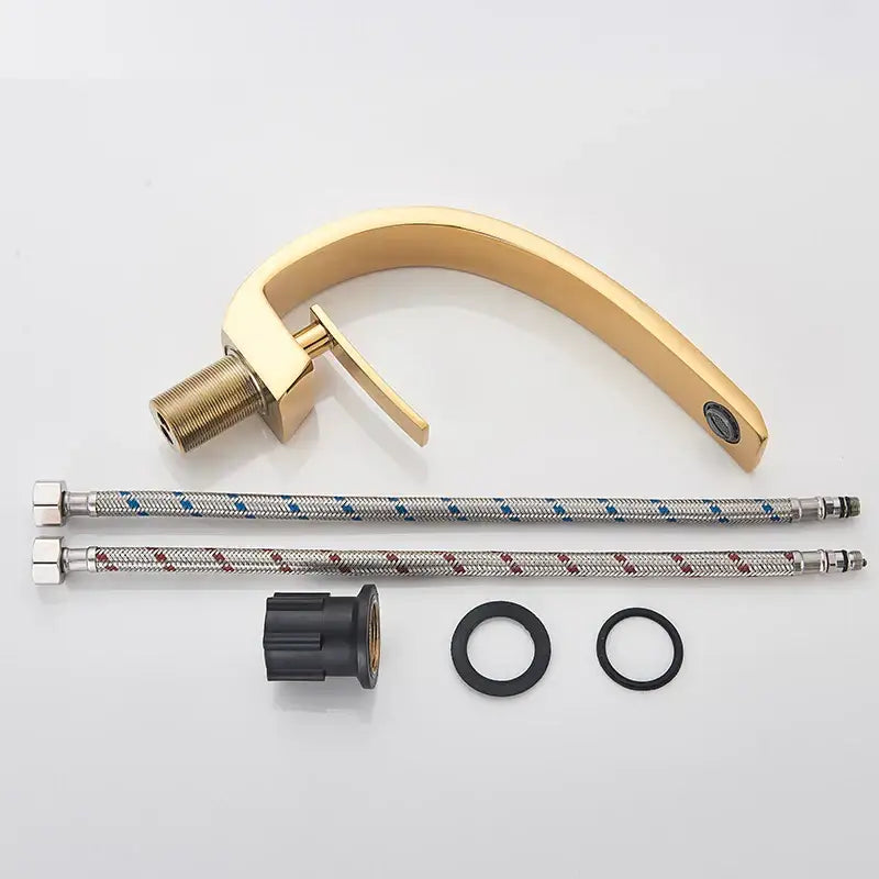 Modern brass faucet with gold-toned finish and sleek curved spout for faucet hot cold water mixer in bathroom vanity sink