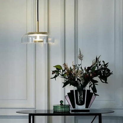 Modern brass floor lamp with glass lampshade featuring a clear glass dome and brass accents for living room decorbites circular glass
