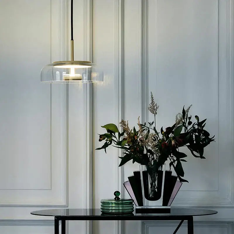 Modern brass floor lamp with glass lampshade featuring a clear glass dome and brass accents for living room decorbites circular glass