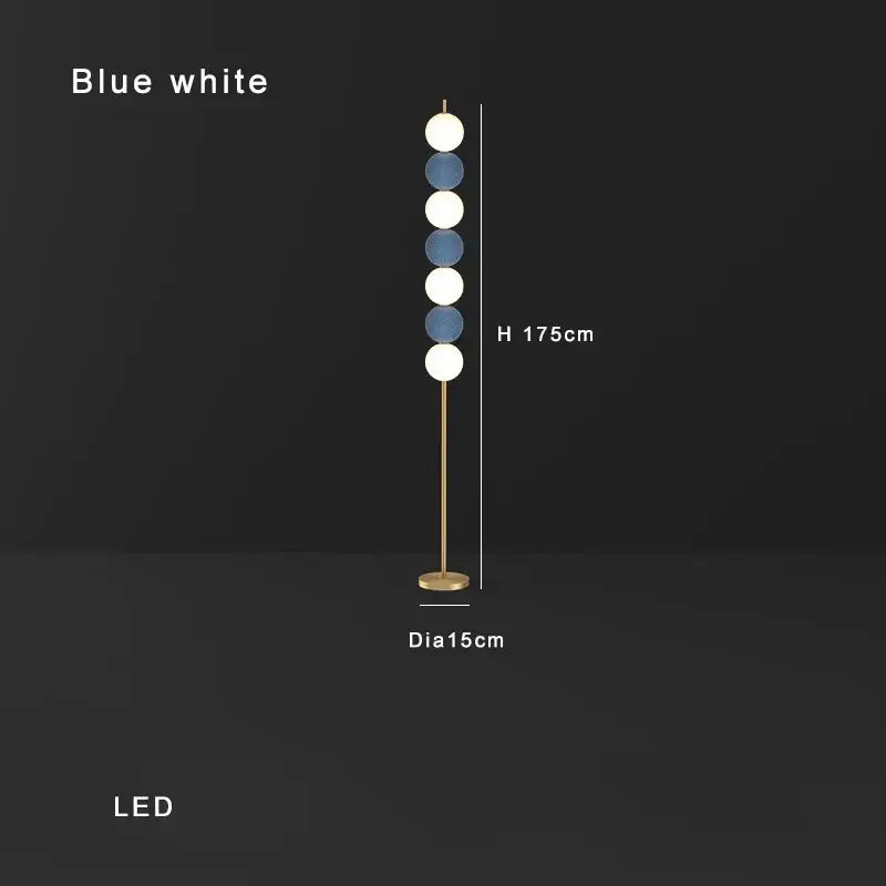 Modern brass floor lamp with slender gold-toned stand and six alternating blue and white spheres for living room decorbites brass floor lamp