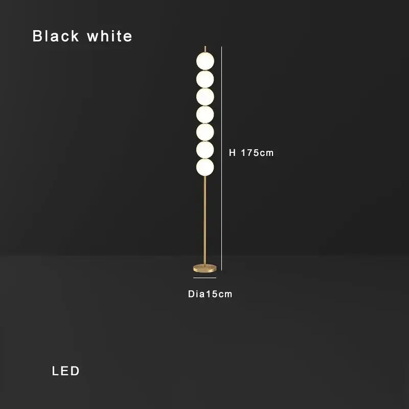 Modern brass floor lamp with six white spherical led bulbs on brass-finished metal stand for living room decorbites decor