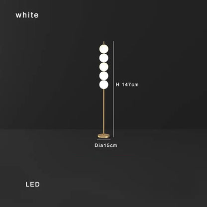 Modern brass floor lamp with five white spherical bulbs and gold-toned metal stand ideal for living room decorbites brass floor lamp