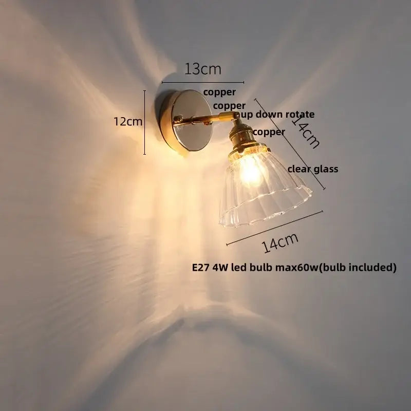 Modern brass floral wall sconce with copper adjustable arm and clear glass shade by decorbites clear glass decor
