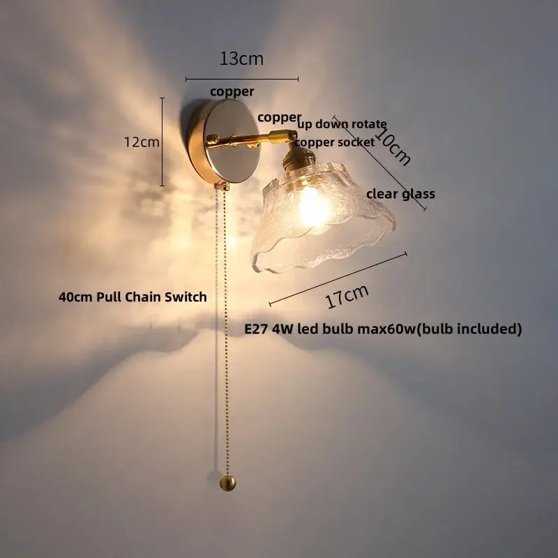 Modern brass floral wall sconce with clear glass shade and copper finish featuring an e27 led bulb decorbites clear glass