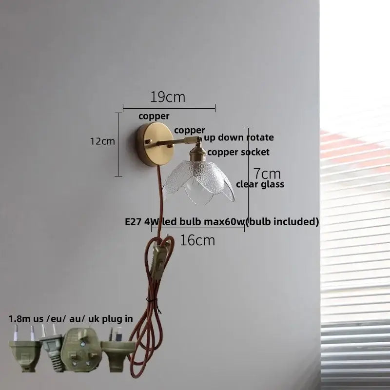 Modern brass floral wall sconce with copper adjustable arm and clear glass flower-shaped shade decorbites clear glass design