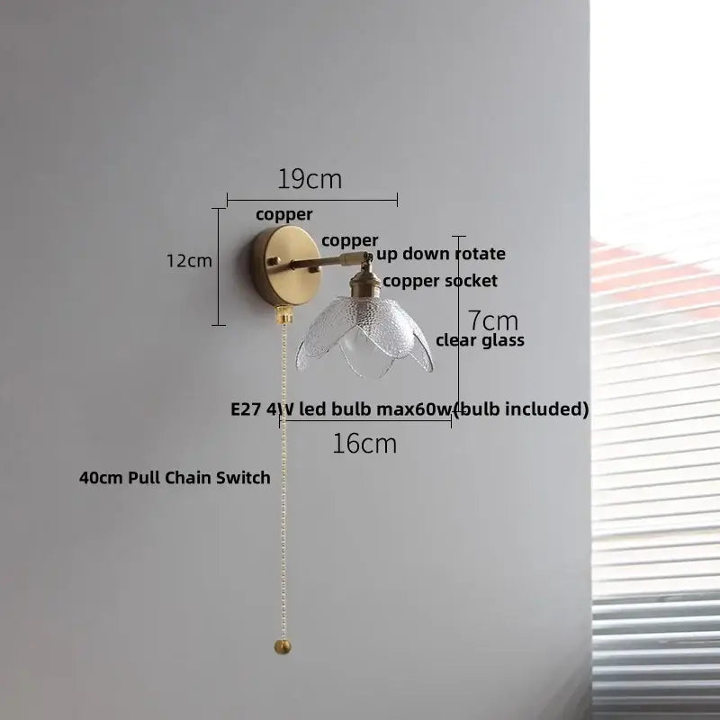 Modern brass floral wall sconce with clear glass flower-shaped shade and 40cm pull chain switch decorbites clear glass design