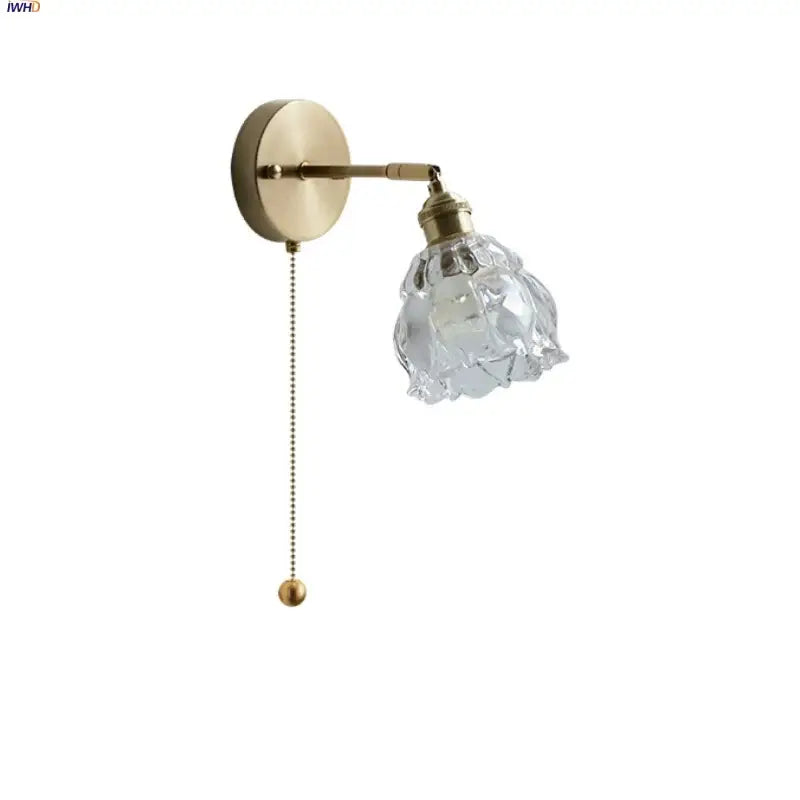 Modern brass flower glass base led wall sconce with faceted clear glass shade for elegant bedroom lighting decorbites wall sconce