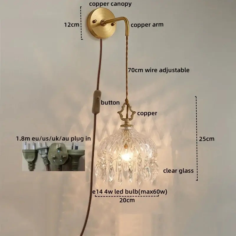 Antique brass-finished copper led wall sconce with clear glass crystal chandelier shade and dangling crystals decorbites led wall