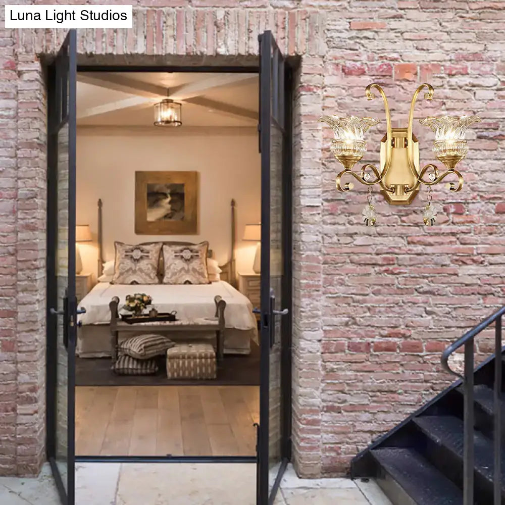 Modern brass flower sconce wall lamp with gold-toned finish, ornate glass shades, and crystal accents light fixture