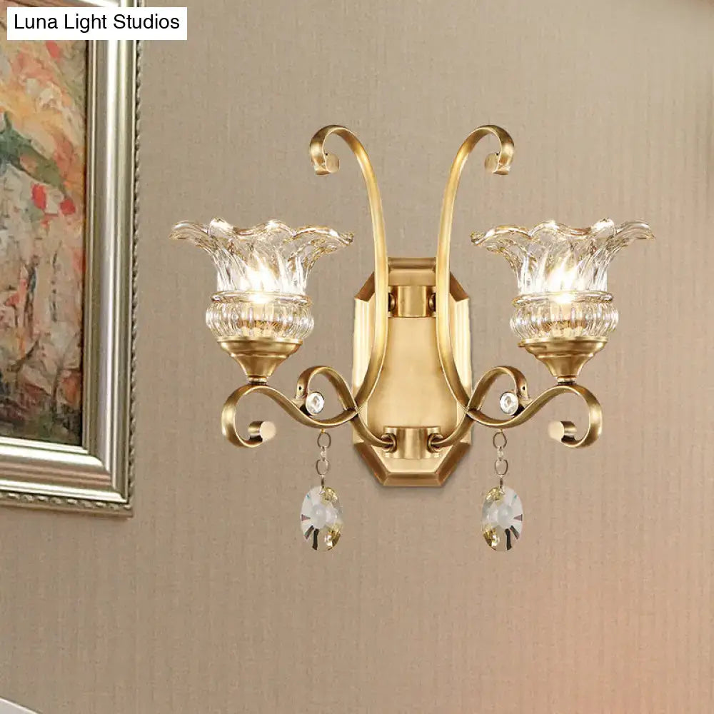 Modern brass flower sconce wall lamp with gold-toned frame and crystal glass shades for bedroom light fixture
