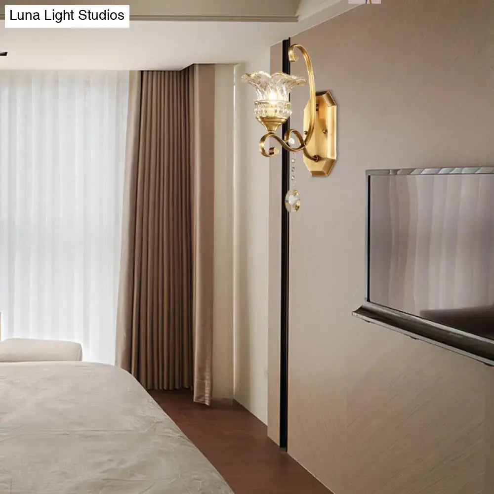 Modern brass flower sconce wall lamp with gold tone crystal glass shade and dangling crystal accent light fixture