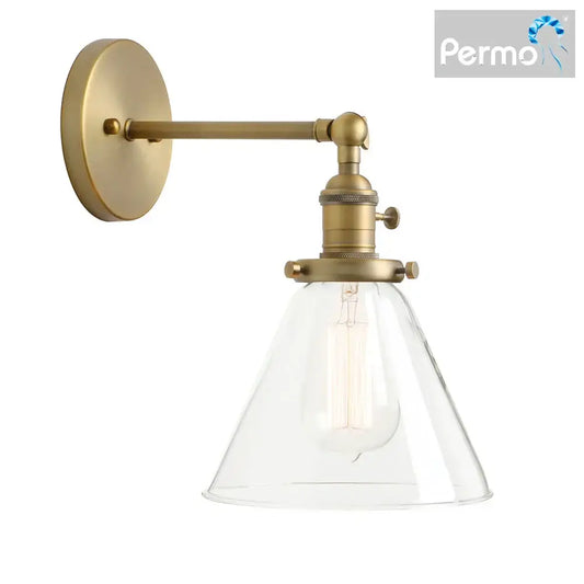 Modern brass funnel glass wall lamp with clear conical shade and exposed filament bulb for bedroom lighting decorbites funnel glass