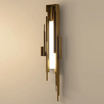 Modern brass geometric elegant wall lamp featuring layered rectangular bars framing a frosted glass panel for living room use