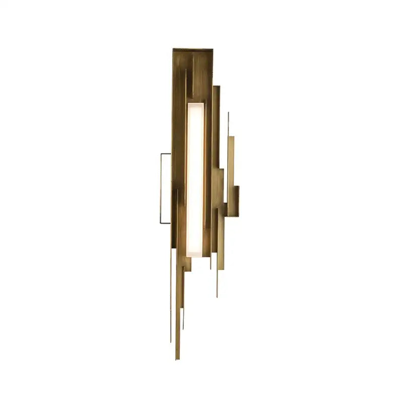 Modern brass wall lamp with geometric layered design featuring vertical bars and an illuminated elegant wall panel