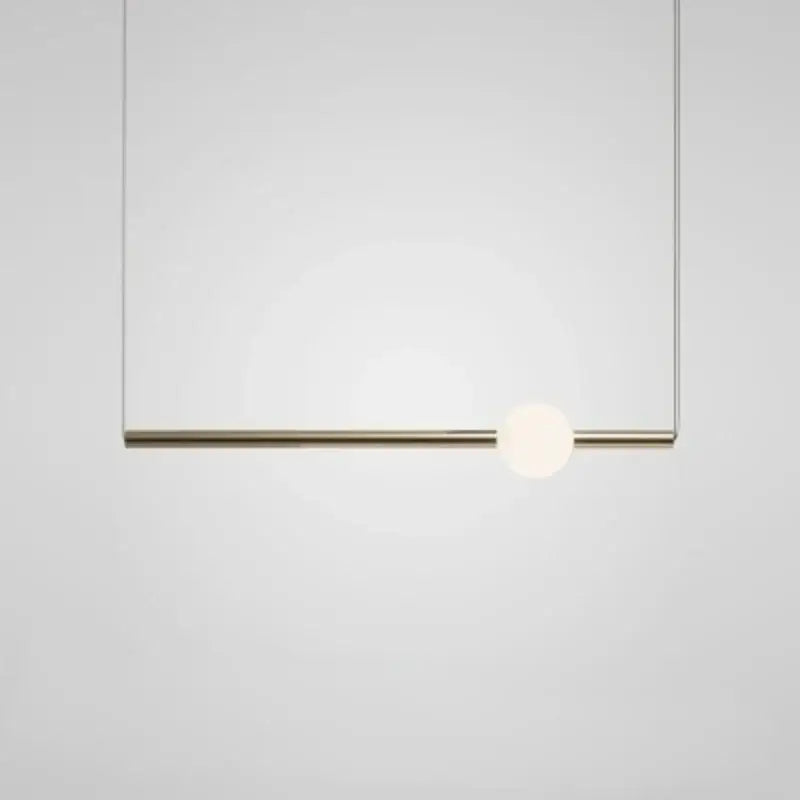 Modern brass geometric glass pendant light with a sleek rod and frosted globe ideal for dining room pendant lights
