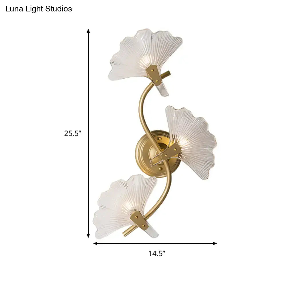 Modern brass ginkgo leaves wall light with gold-toned three translucent fan-shaped glass shades for bedroom use