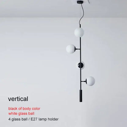 Modern brass glass ball chandelier with black vertical pendant and four white glass spheres for living room decorbites brass glass