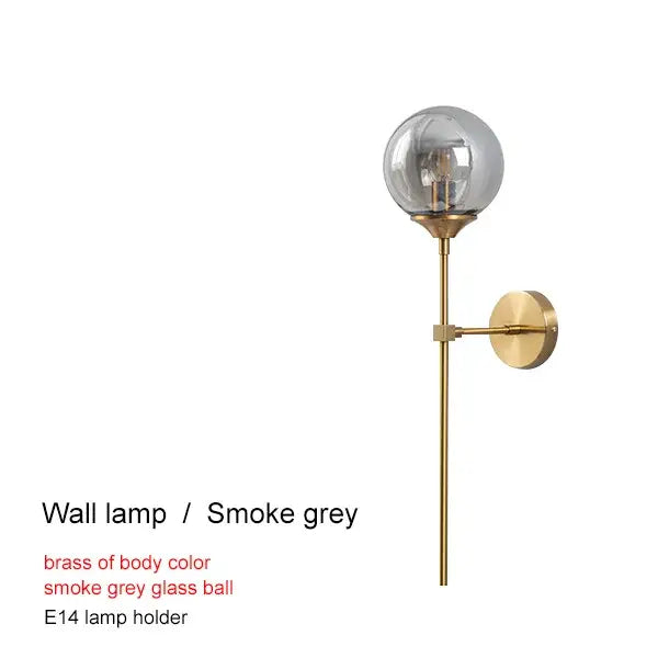 A modern brass glass ball chandelier with a sleek smoke grey glass globe and e14 bulb holder for decorbites brass glass decor