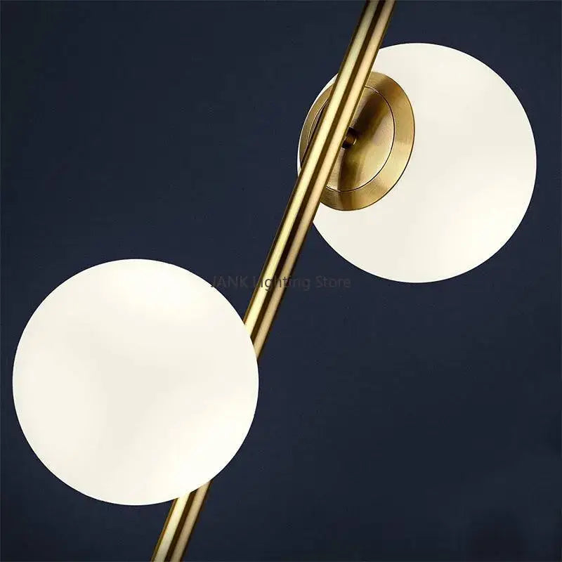 Modern brass floor lamp with two opal glass ball shades ideal for bedroom and study decorbites glass ball design