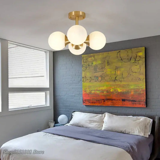 Modern brass ceiling lights with four frosted glass globes from decorbites glass ball led collection for living room decor