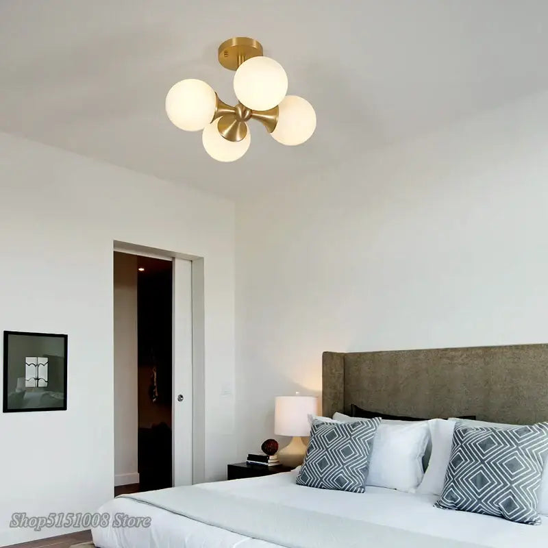 Modern brass glass ball led ceiling lights with gold-toned fixture and five frosted glass globe shades for living room decorbites ceiling lights
