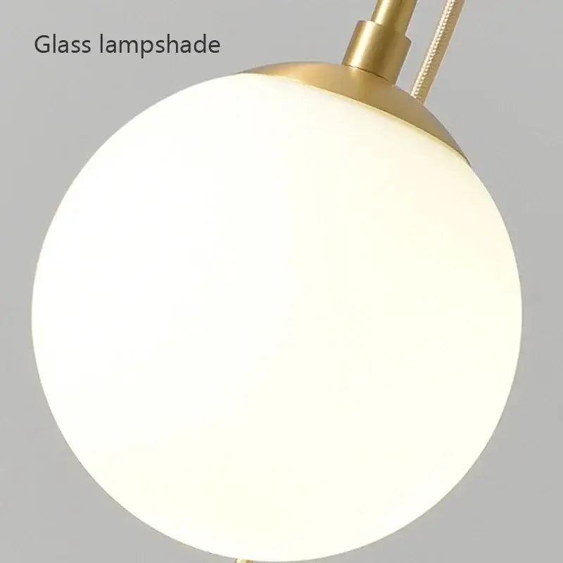 Modern brass glass ball led chandelier with sleek frosted glass lampshade and polished brass fixture for dining room decorbites glass ball