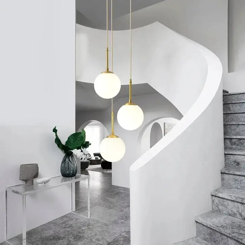 Modern brass glass ball led chandelier with three gold metal fixtures and frosted glass globes for dining room decorbites glass ball