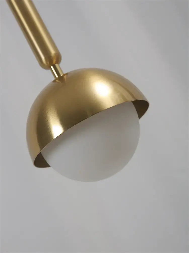 Modern brass glass ball led pendant chandelier featuring a gold-toned dome and frosted glass globe for dining room decorbites glass ball