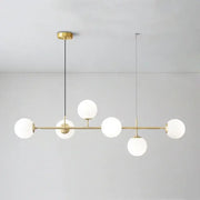 Modern brass pendant light with five frosted glass globe shades from decorbites glass ball led collection for living room decor