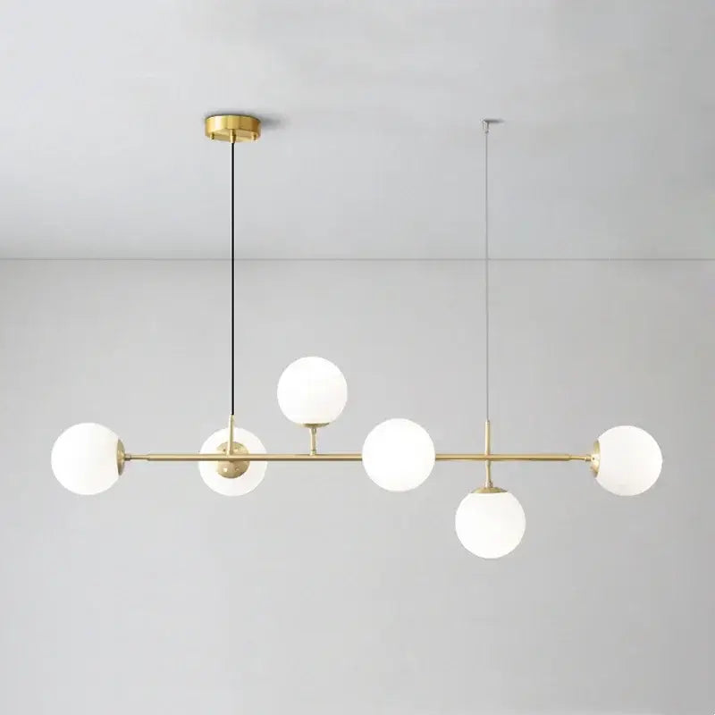 Modern brass pendant light with five frosted glass globe shades from decorbites glass ball led collection for living room decor
