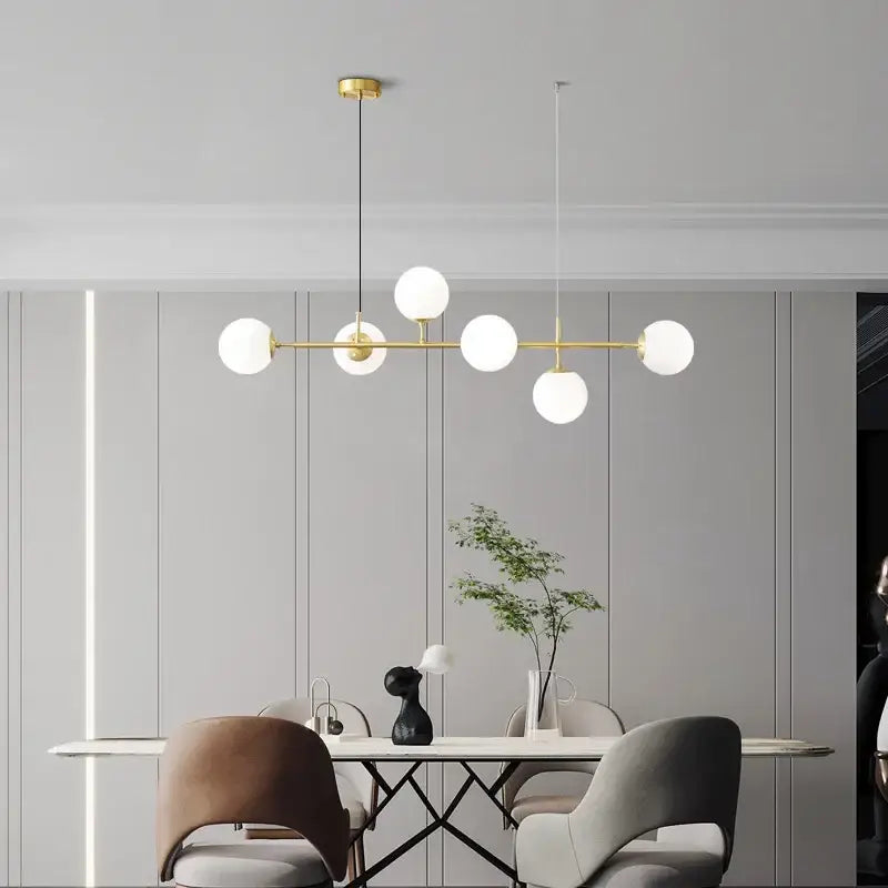 Modern brass pendant light with five frosted glass ball led globes from decorbites for stylish living room decor