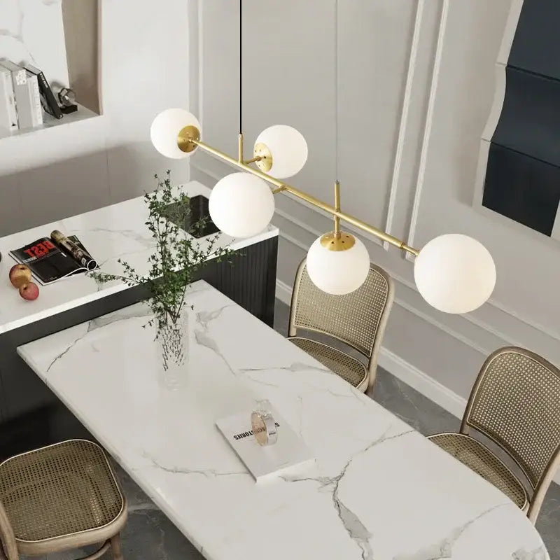Modern brass glass ball led pendant light with five white glass globe shades for living room decorbites pendant light
