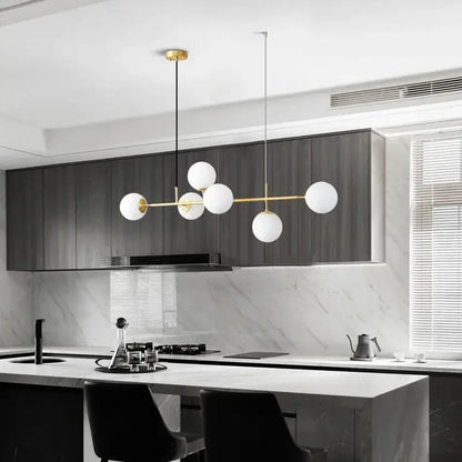 Modern pendant light with gold-toned metal frame and five white glass ball led shades for living room decorbites glass ball