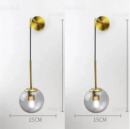 Modern brass glass ball led wall light with gold-toned spherical pendant and clear glass globe for bedroom decorbites wall light