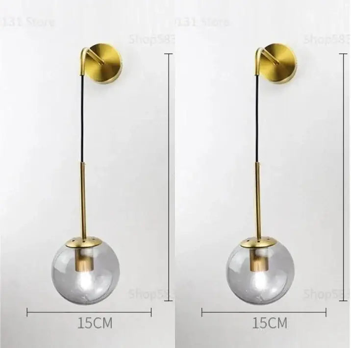 Modern brass glass ball led wall light with gold-toned spherical pendant and clear glass globe for bedroom decorbites wall light