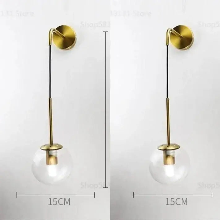 Modern brass glass ball led wall light with gold-toned brass stem and clear glass globe for bedroom decorbites wall light