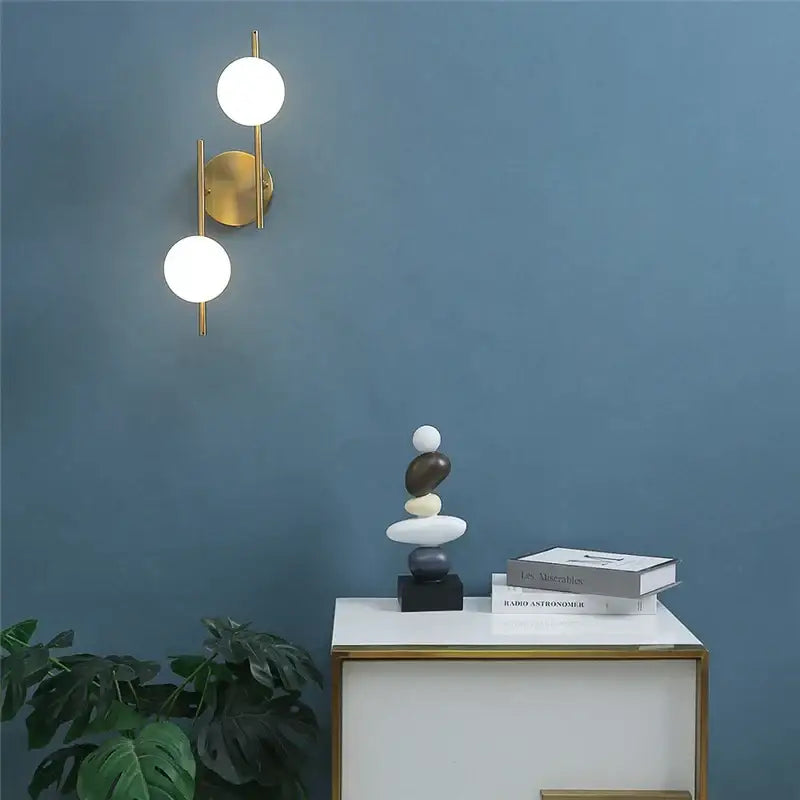 Modern brass glass ball led wall light with two spherical white glass shades for bedroom decorbites glass ball led sconce
