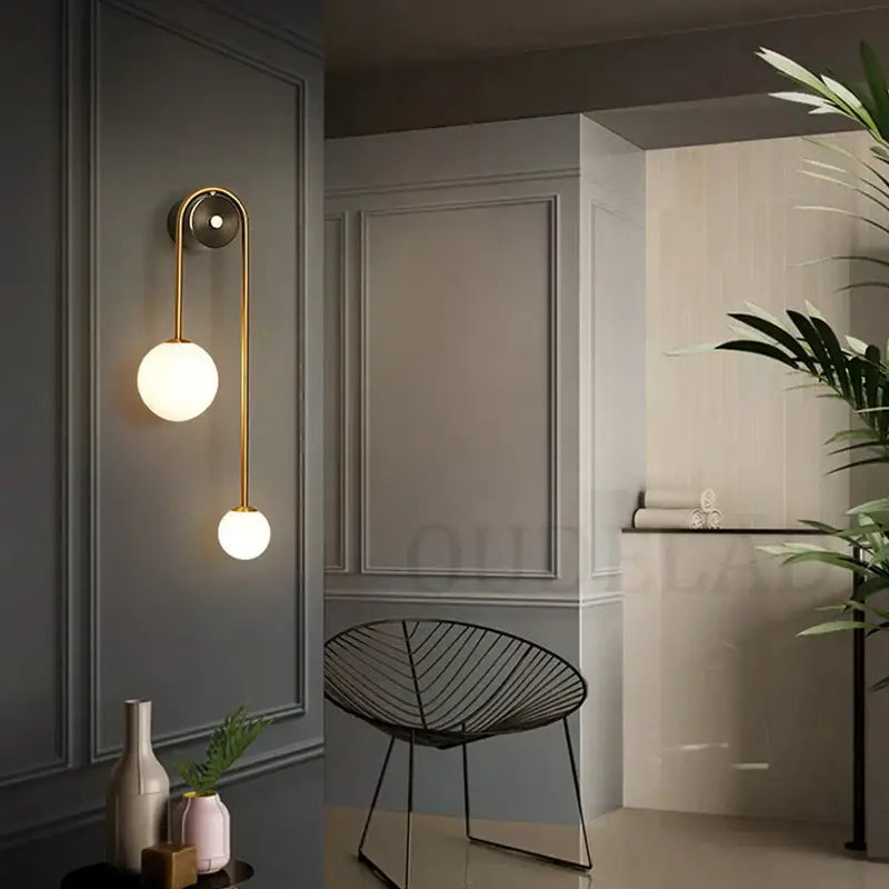 Modern brass glass ball led wall light with gold-toned sconce and two frosted glass shades for bedroom decorbites wall light