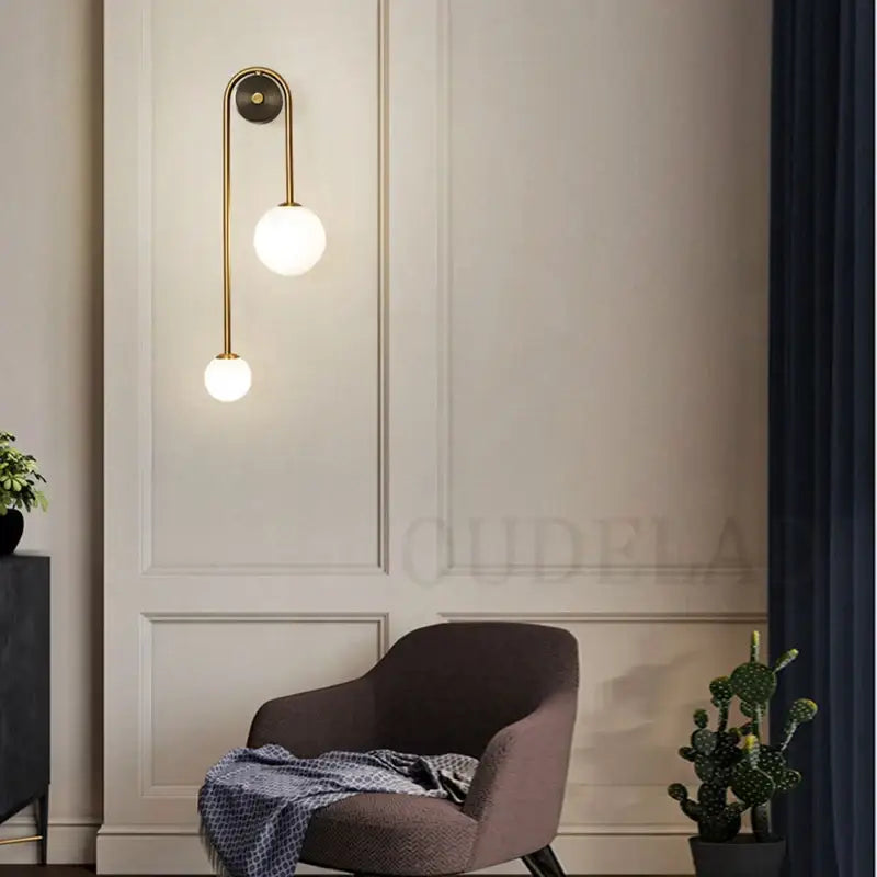 Modern brass glass ball led wall light in gold tone with two frosted glass shades for bedroom decorbites wall light