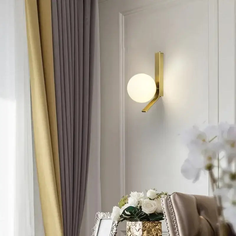 Modern brass glass ball led wall sconce with gold-toned metal and frosted glass shade for bedroom decorbites wall sconce