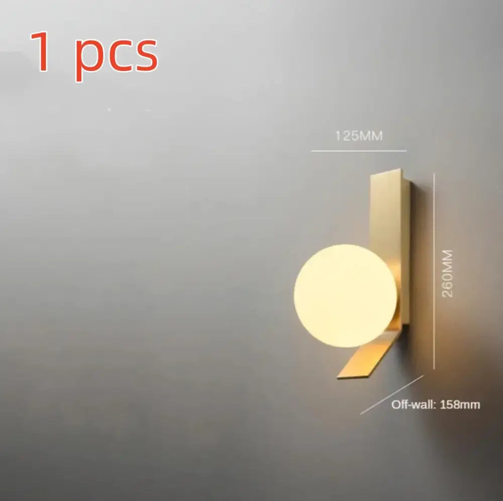 Modern brass glass ball led wall sconce with gold-toned metal bracket and circular frosted glass diffuser for bedroom decorbites wall sconce
