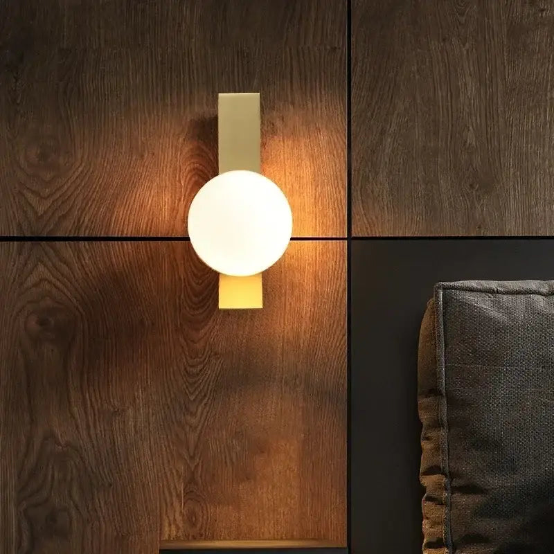 Modern brass glass ball led wall sconce with matte gold backplate and frosted white glass ball for bedroom decorbites wall sconce