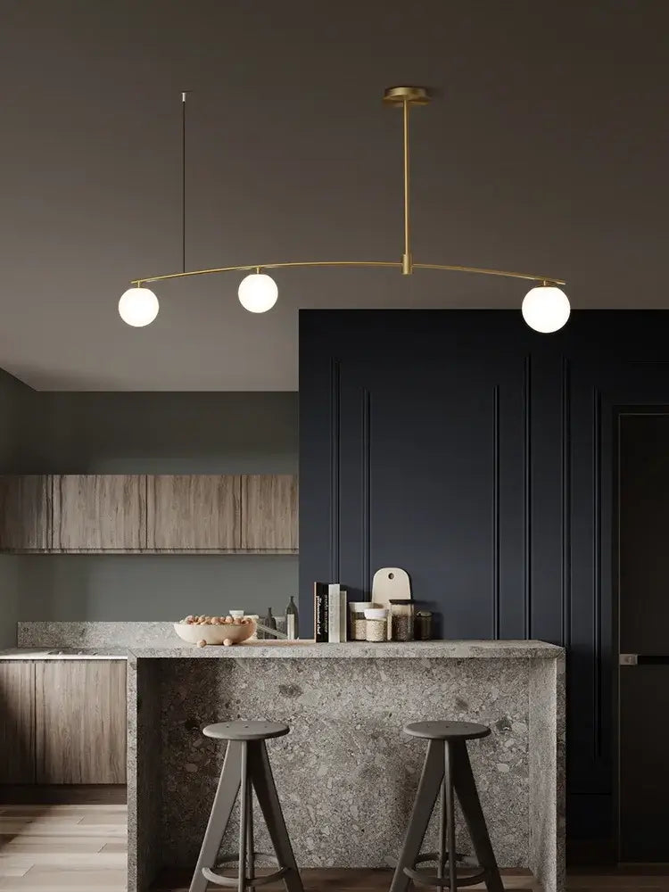Modern brass glass ball pendant chandelier with three white globe bulbs for dining room decorbites glass ball pendant