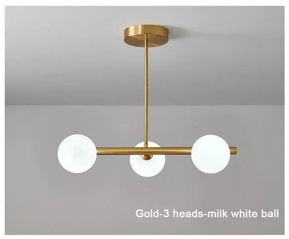 Modern brass glass ball pendant chandelier with gold finish and three milk-white glass bulbs for dining room decorbites glass ball
