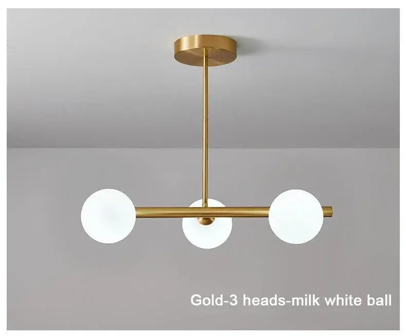 Modern brass glass ball pendant chandelier with gold finish and three milk-white glass bulbs for dining room decorbites glass ball