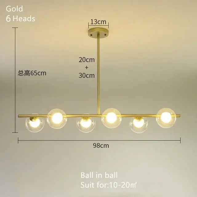 Modern brass glass ball pendant chandelier with six gold-finished glass globe lights for dining room decorbites glass ball