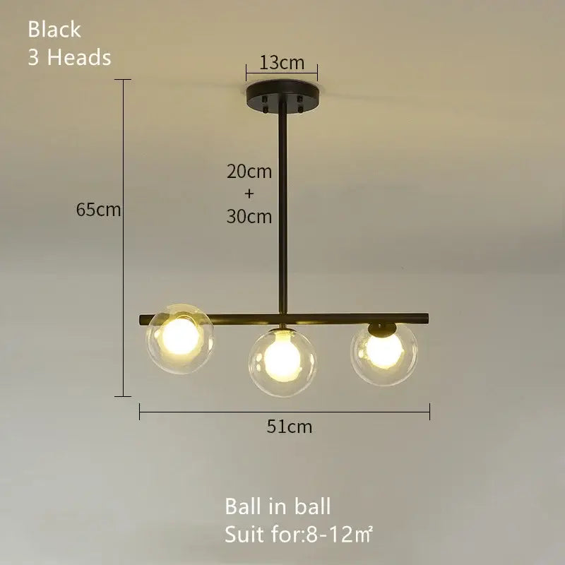 Modern brass glass ball pendant chandelier with black metal frame and clear glass globe bulbs for dining room decorbites glass ball