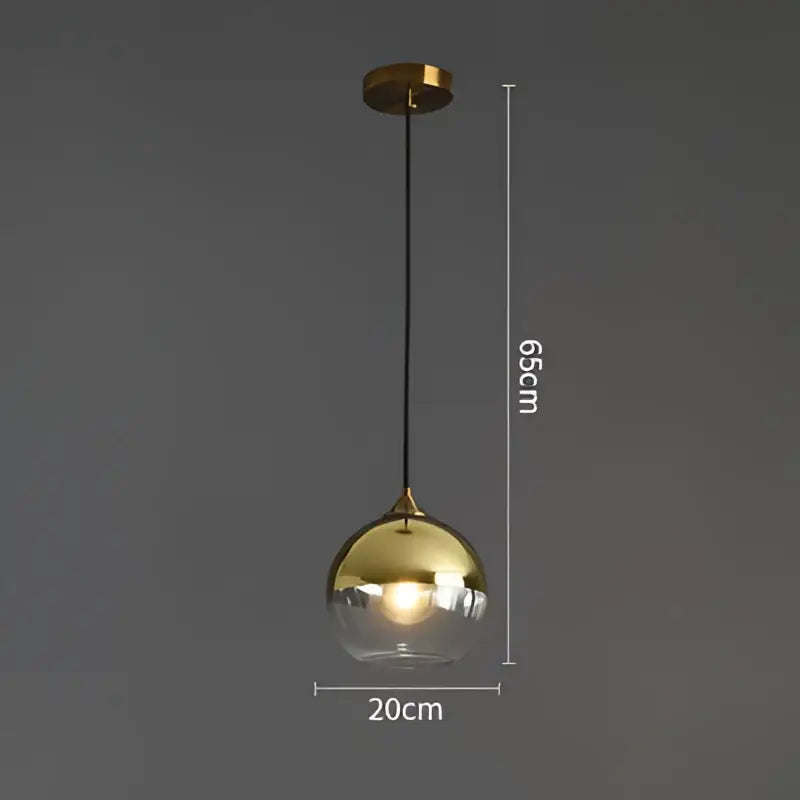 Modern brass glass ball pendant light with gold finish clear glass globe and black cord for dining and kitchen decorbites