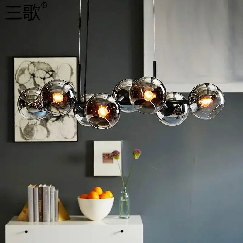 Modern black metal chandelier pendant lights with clear glass ball shades and warm bulbs for kitchen decorbites glass ball lighting