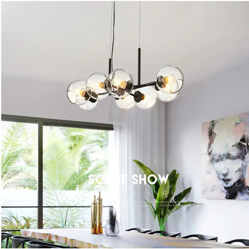 Modern black metal pendant lights with clear glass globe shades and exposed filament bulbs for kitchen decorbites glass ball pendant
